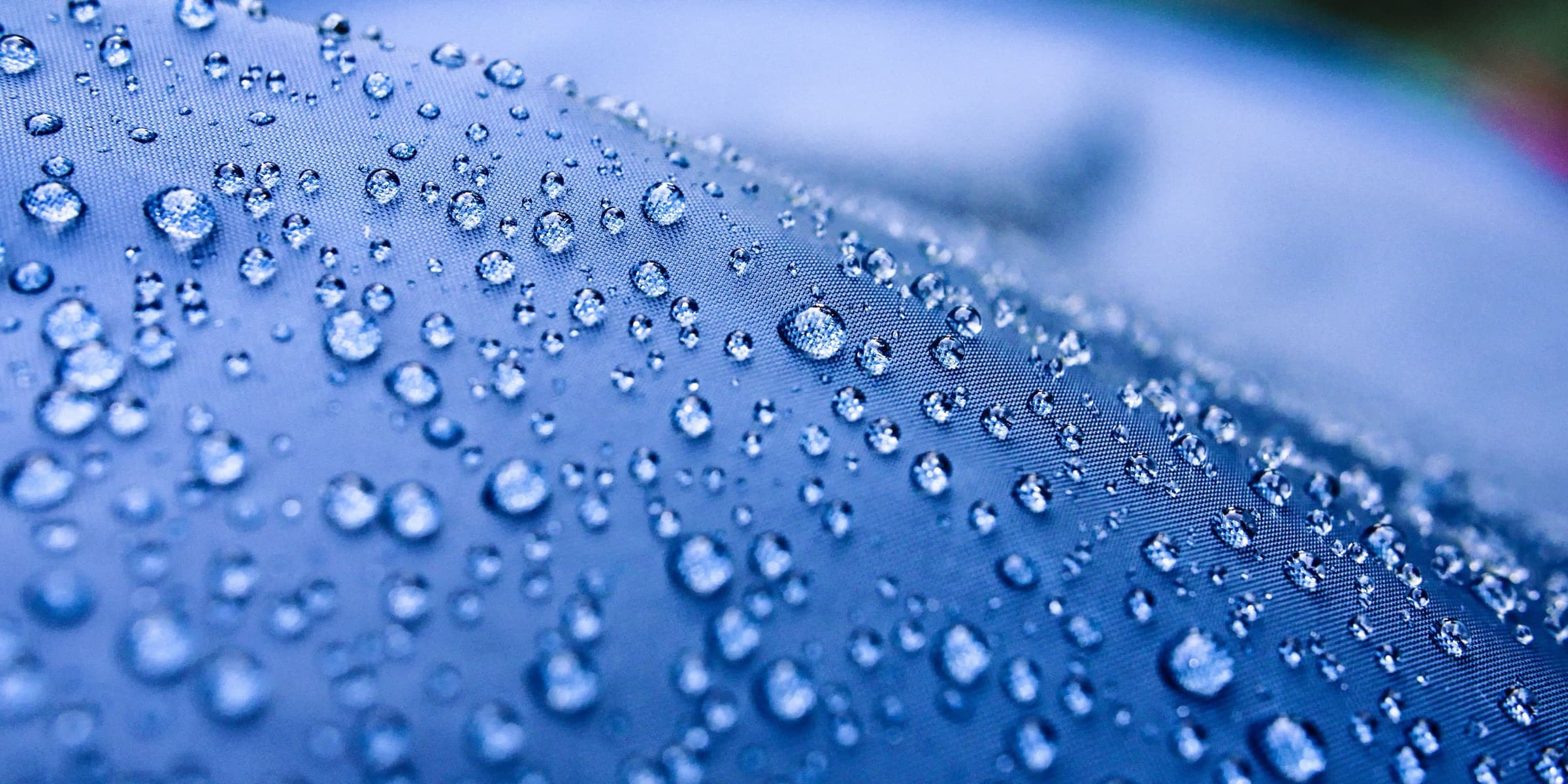 Water droplets on a blue surface